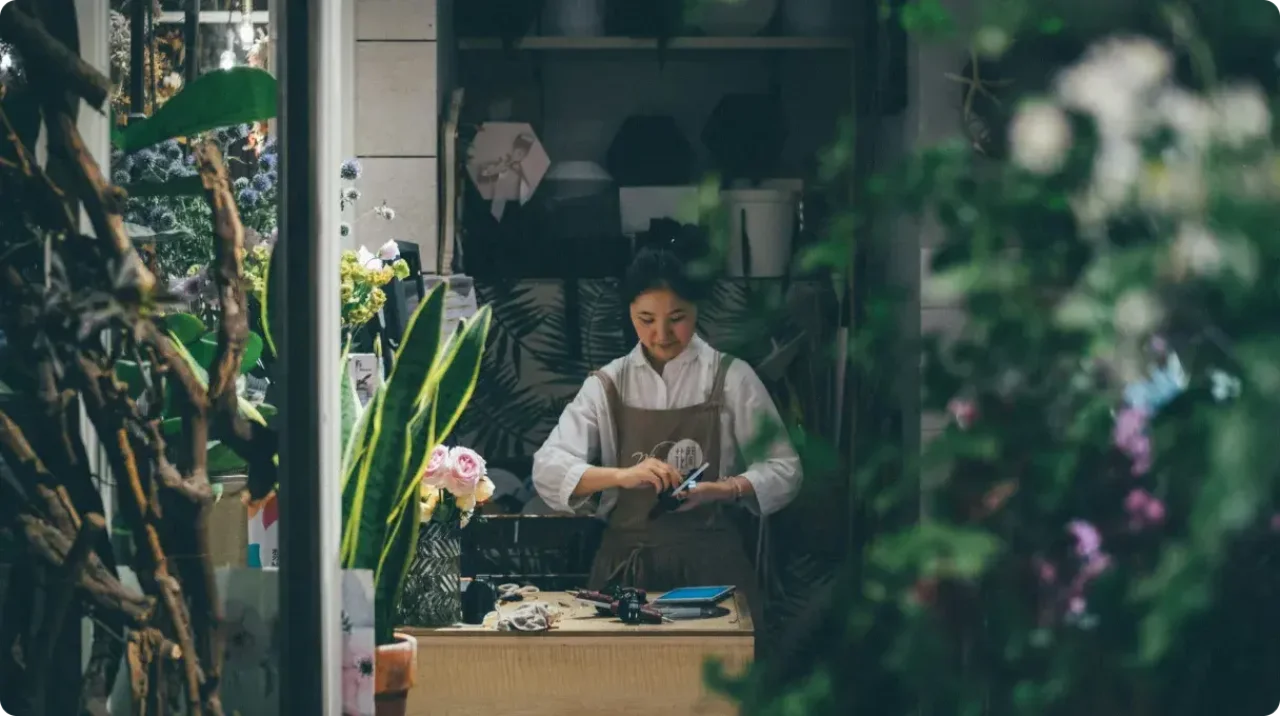 Florist Working Inside Flower Shop