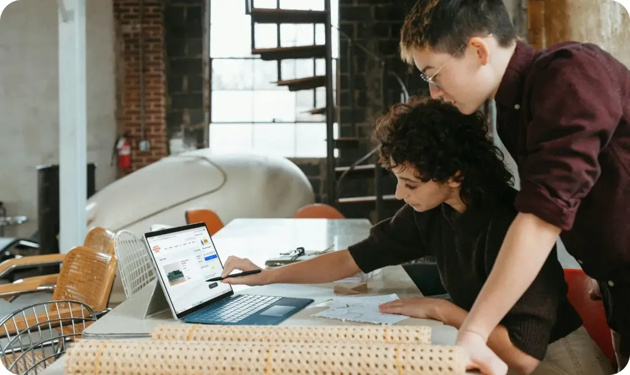 Two people learning how to run a business