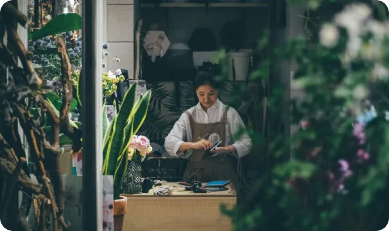 Woman Working In Flower Shop