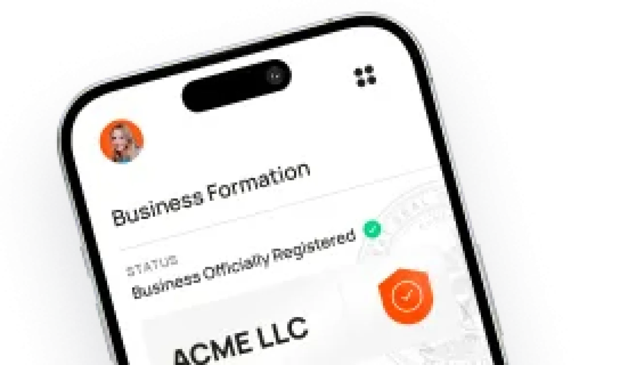 Mobile phone screen showing a business formation app with the status “Business Officially Registered” for ACME LLC.