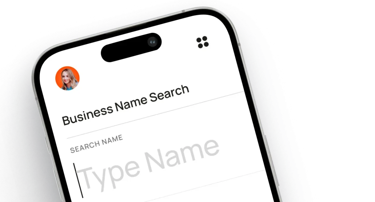 Smartphone screen showing business name search app with input field to type company name