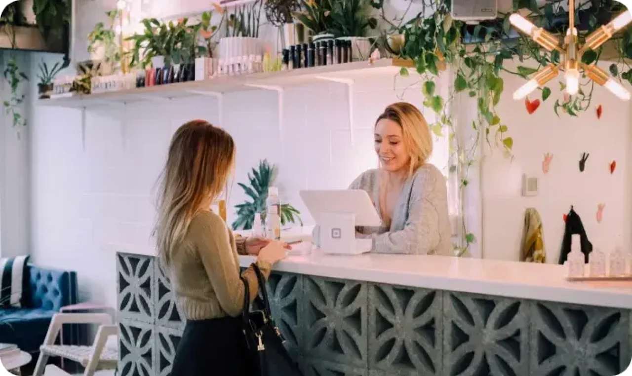Woman ordering in front of another woman